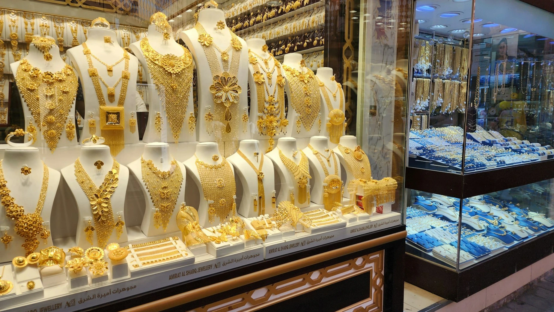 a display case filled with lots of gold jewelry